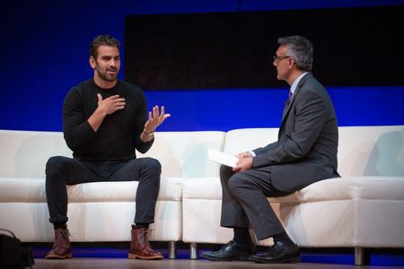 Nyle DiMarco on stage at the Social Good Summit with Rajesh Mirchandani (CCO at the United Nations Foundation)