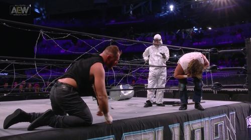 Kenny Omega, Jonathan Good, and Bryce Remsburg in All Elite Wrestling: Revolution (2021)