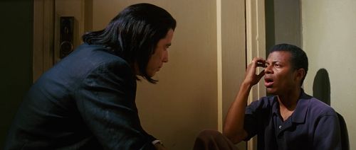 John Travolta and Phil LaMarr in Pulp Fiction (1994)