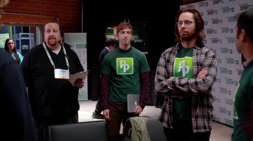 The Tech Crunch Disrupt stage manager (Ben Zelevansky) summons Pied Piper (Thomas Middleditch, Martin Starr and Kumail N