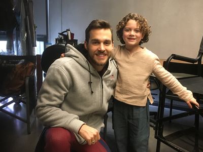 Benjamin Goas on the set of SuperGirl with Chris Wood