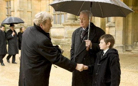Michael Caine, Rutger Hauer, and Gus Lewis in Batman Begins (2005)
