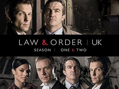Jamie Bamber, Ben Daniels, Bradley Walsh, and Freema Agyeman in Law & Order: UK (2009)