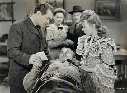 Johnny Mack Brown, Lynne Carver, Douglass Dumbrille, John Merton, and Joan Woodbury in Flame of the West (1945)