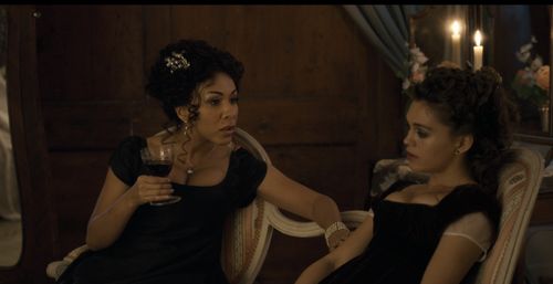 Kathryn Drysdale and Sienna Bartlett as Genevieve Delacroix and Siena Rosso in Bridgerton