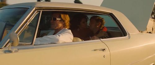 Brad Pitt, Leonardo DiCaprio, and Lorenza Izzo in Once Upon a Time in Hollywood (2019)