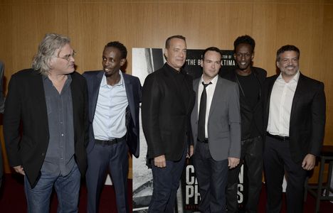 Tom Hanks, Michael De Luca, Dana Brunetti, Paul Greengrass, Barkhad Abdi, and Mahat M. Ali at an event for Captain Phill