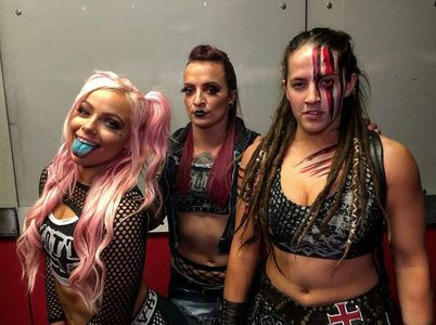 Sarah Bridges, Dori Elizabeth Prange, and Gionna Daddio at an event for WWE Elimination Chamber (2019)
