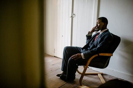 A pensive Atandwa Kani on the set of The Suit (2016)