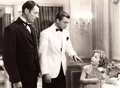 Shirley Temple, Robert Young, and Arthur Treacher in Stowaway (1936)