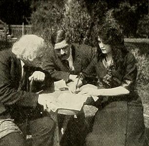 George Periolat, Vivian Rich, and Jack Richardson in Oil on Troubled Waters (1913)