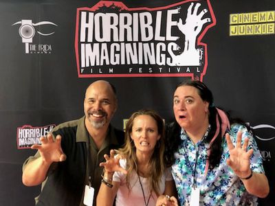Kevin enjoys some red carpet fun with co-star, Sara Fletcher and director, Bears Rebecca Fonté, at the Horrible Imaginin
