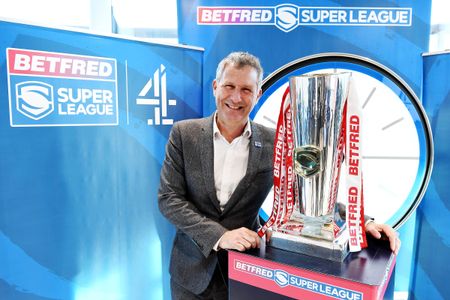 Adam Hills at an event for Channel 4: Super League (2022)