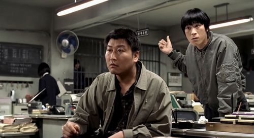 Song Kang-ho, Roe-ha Kim, and Seo-hie Ko in Memories of Murder (2003)