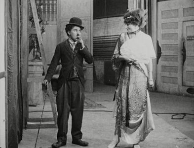 Charles Chaplin and Charlotte Mineau in His New Job (1915)