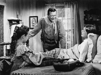 John Wayne, Anne Barton, and Ilana Dowding in The Comancheros (1961)