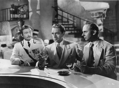 Claude Rains, Paul Henreid, and John Qualen in Casablanca (1942)