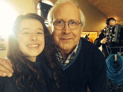 Addison Holley and Chevy Chase on the set of 