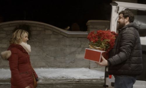 Beverley Mitchell and Derek Johns in A Candy Cane Christmas (2020)