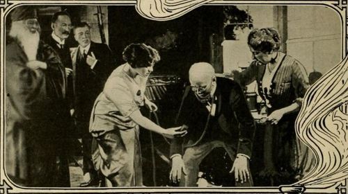 Alfred Bishop, Mary Brough, E. Holman Clark, Lawrence Grossmith, Doris Lytton, and Tom Mowbray in The Brass Bottle (1914
