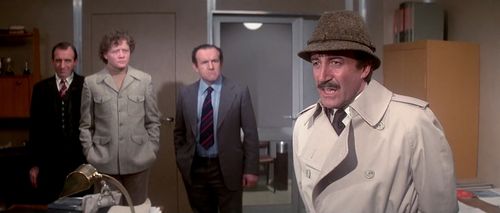 Peter Sellers, Colin Blakely, Leonard Rossiter, and Dudley Sutton in The Pink Panther Strikes Again (1976)