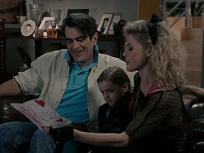Julie Bowen, Ty Burrell, and Jeremy Maguire in Modern Family (2009)