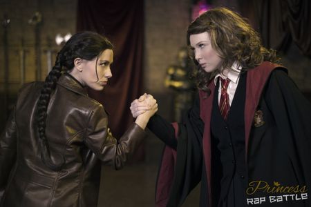 Katniss (Whitney Avalon) and Hermione (Molly C. Quinn) face off in the sixth Princess Rap Battle, written and produced b
