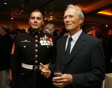 Military Technical Advisor Sgt. Major James Dever, USMC (Ret.) (L) and actor/director Clint Eastwood pose at the afterpa
