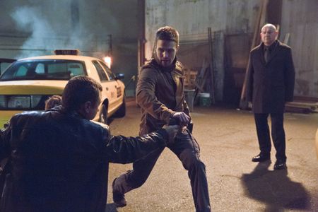 Eugene Lipinski and Stephen Amell in Arrow (2012)