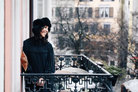 Irina Kastrinidis on winter balkony