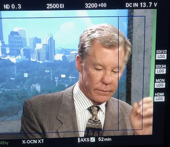Pittsburgh, PA: Kent Shocknek in monitor as '90s news anchor in Discovery Communication's Manhunt.