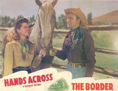 Roy Rogers, Ruth Terry, and Trigger in Hands Across the Border (1944)