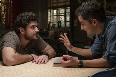 Marco Pigossi and director Carlos Saldanha on the set of Invisible City