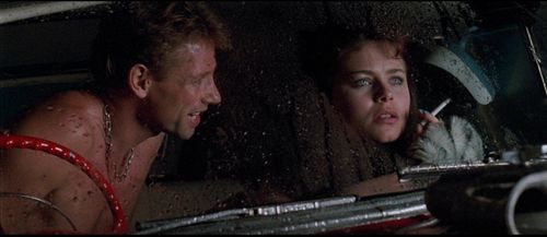 Ned Manning and Natalie McCurry in Dead End Drive-In (1986)