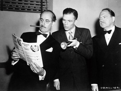 Groucho Marx, Frank Sinatra, and Howard Freeman in Double Dynamite (1951)