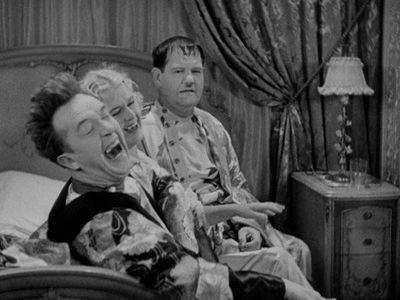 Oliver Hardy, Stan Laurel, and Vivien Oakland in Scram! (1932)