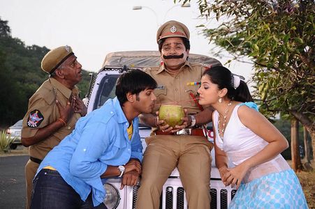 Mohammad Ali, Manoj Kumar Manchu, and Taapsee Pannu in Jhummandi Naadam (2010)