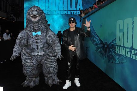 Portraying Godzilla At the premiere of Godzilla King of The Monsters with Gene Simmons on the black carpet.