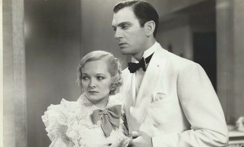 Walter Woolf King and Marian Nixon in Embarrassing Moments (1934)