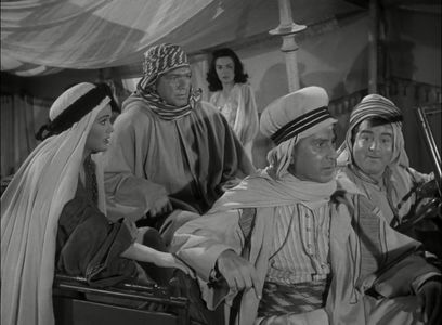 Bud Abbott, Lou Costello, William 'Wee Willie' Davis, Charmienne Harker, and Patricia Medina in Abbott and Costello in t