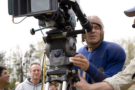 Producer Casey Silver (gray sweatshirt) and director George Clooney on the set of LEATHERHEADS