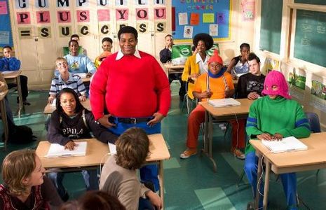Doris (Kyla Pratt, seated left) brings her new friends, Fat Albert (Kenan Thompson) and the Cosby Kids to class with her