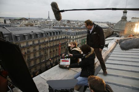 Hans Royaards on a Paris rooftop directing actor Mattias Van de Vijver in Christmas in Paris