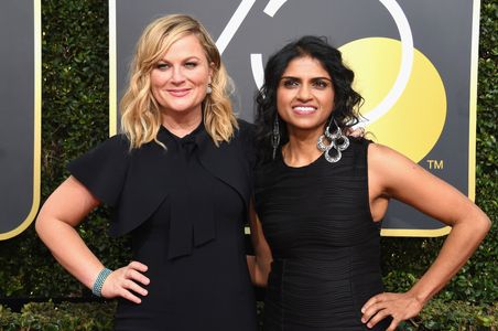 Amy Poehler and Saru Jayaraman at an event for 75th Golden Globe Awards (2018)