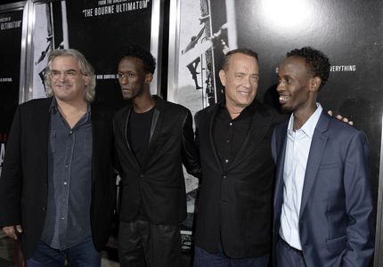 Tom Hanks, Paul Greengrass, Barkhad Abdi, and Mahat M. Ali at an event for Captain Phillips (2013)