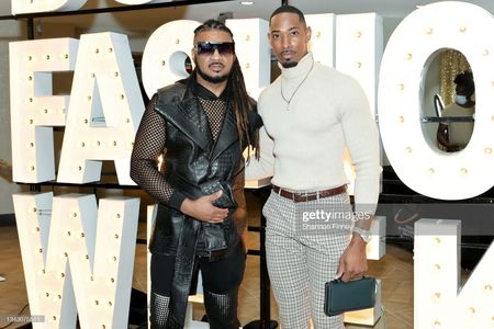 WASHINGTON, DC - SEPTEMBER 26: Ean Williams, Executive Director of DC Fashion Week, and television personality/model Jar