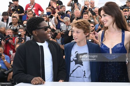 CANNES, FRANCE - MAY 20: (L to R) Jaylin Webb, Michael Banks Repeta, and Anne Hathaway attend the photocall for 