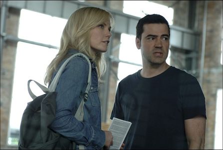 Laura Harris and Ron Livingston in Defying Gravity (2009)