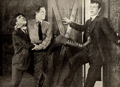 Karl Dane and Charles Hutchison in The Whirlwind (1920)
