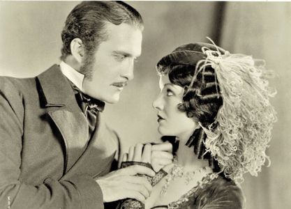Myrna Loy and Douglas Gilmore in Cameo Kirby (1930)